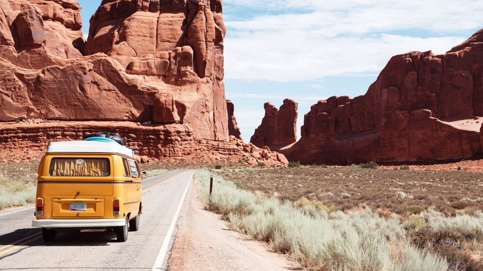Rural highway through desert mountains — northern Nevada travel vibe